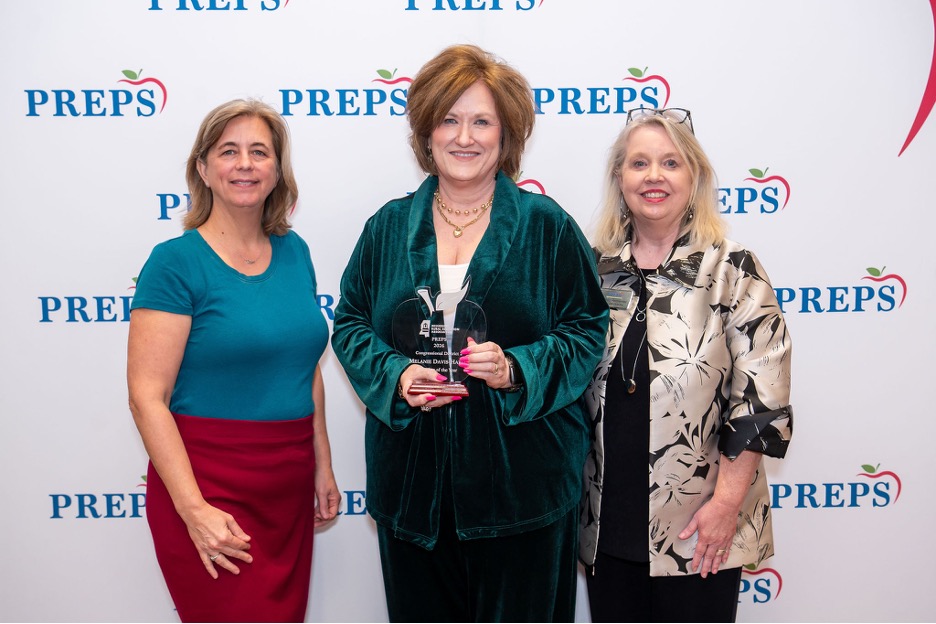 Teacher of the Year winner Melanie Davis-Hardy with Devon Brenner and Patti Permenter.